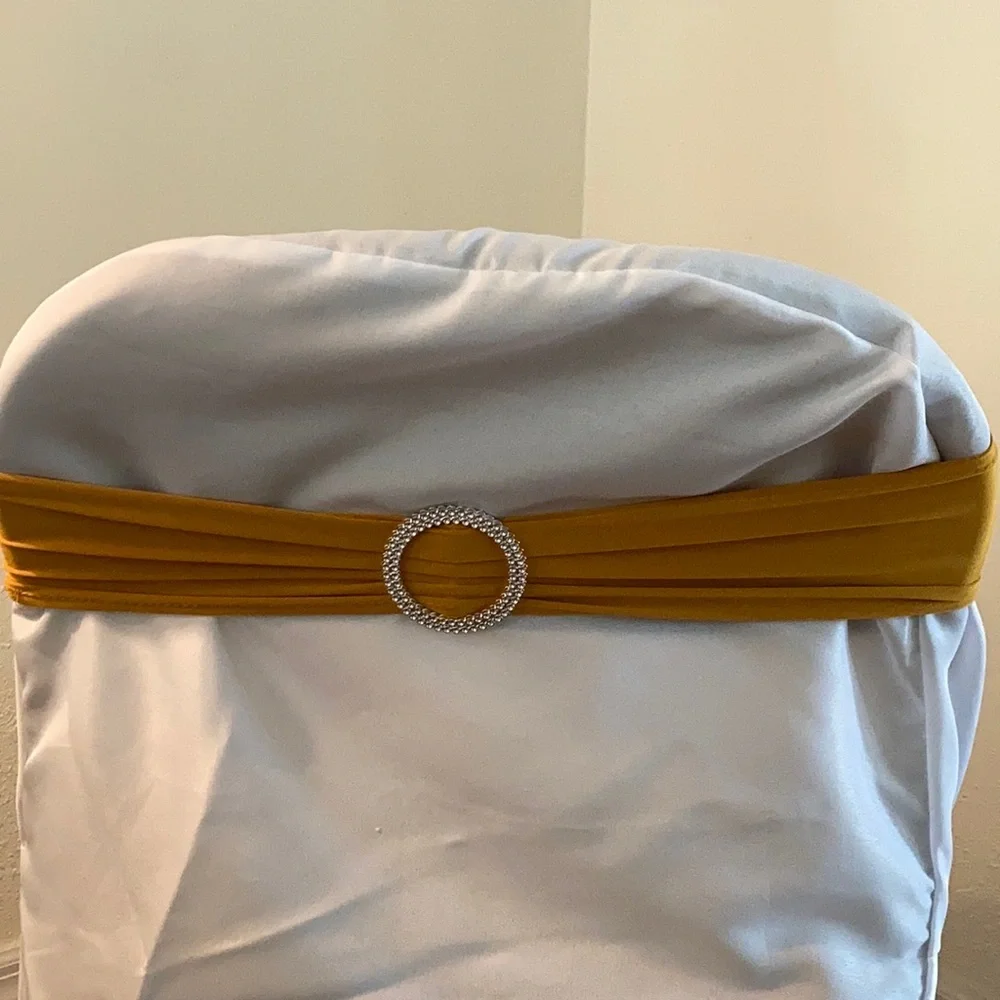 Chair Covers & gold chair bows New Year’s Eve, wedding, graduation, decor